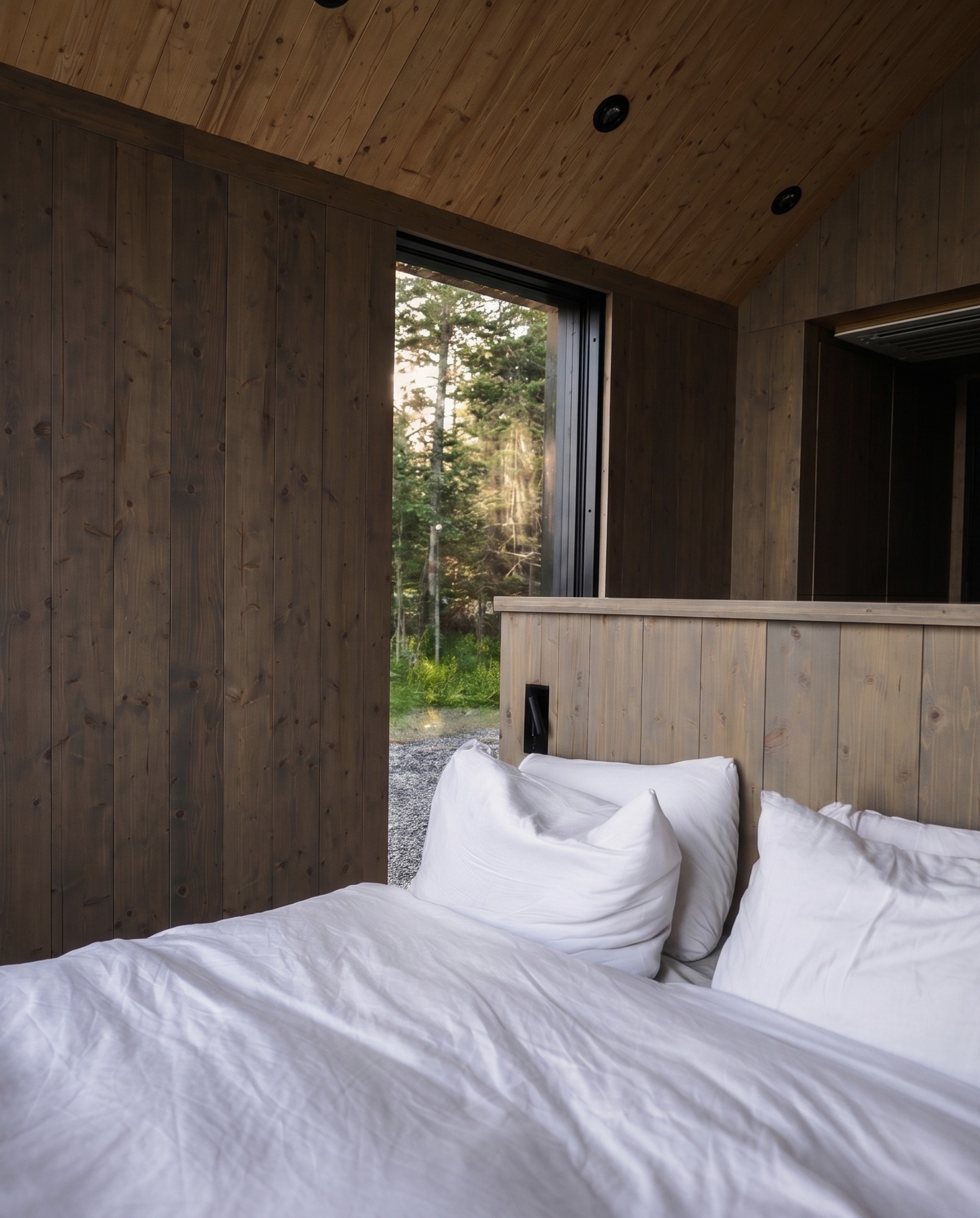 Cabin bedroom looking out to the forest